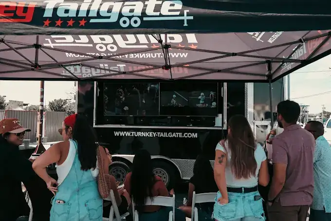 Fans watching the game on the trailer TVs