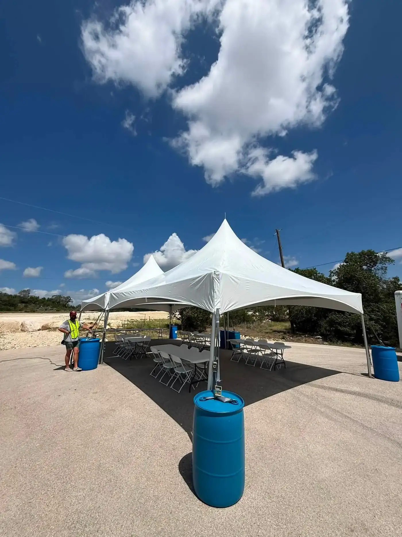 Row of high peak tents on concrete